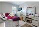 This bedroom has plush carpet, a ceiling fan, and natural light from the large window at 727 Porter Rye Ave, Debary, FL 32713