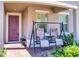 Inviting front porch features a comfortable seating swing and brick paved entryway, perfect for relaxing at 727 Porter Rye Ave, Debary, FL 32713
