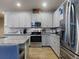 Modern kitchen boasts granite countertops, stainless steel appliances, and ample cabinet space for storage at 727 Porter Rye Ave, Debary, FL 32713