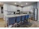 Open kitchen features a large center island with bar seating, stainless steel appliances, and plenty of counter space at 727 Porter Rye Ave, Debary, FL 32713