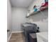 Convenient laundry room features a modern washer and dryer, plus shelving for storage at 727 Porter Rye Ave, Debary, FL 32713