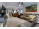 Open living room with view to dining room and kitchen with carpet flooring at 727 Porter Rye Ave, Debary, FL 32713