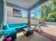 Covered patio features a comfortable seating area and play area for outdoor relaxation at 727 Porter Rye Ave, Debary, FL 32713
