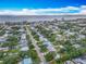 Expansive aerial view of a residential area near the ocean, featuring well-kept homes and tree-lined streets at 805 E 15Th Ave, New Smyrna Beach, FL 32169