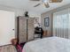Bedroom with ceiling fan, wardrobe, desk area, and decor at 805 E 15Th Ave, New Smyrna Beach, FL 32169