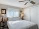 Bright bedroom featuring a large window and a white quilt bed set at 805 E 15Th Ave, New Smyrna Beach, FL 32169