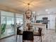 Dining area next to the kitchen featuring a round table and sliding door to the patio at 805 E 15Th Ave, New Smyrna Beach, FL 32169