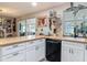 Kitchen area with wood countertop, white cabinets and view into the dining area and sunroom at 805 E 15Th Ave, New Smyrna Beach, FL 32169