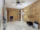 Spacious basement with built-in shelving and tile flooring at 830 Christy Dr, Port Orange, FL 32129