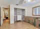Bedroom with closet organizers, laminate flooring, a window and neutral paint at 830 Christy Dr, Port Orange, FL 32129