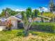 Charming single-story home featuring a well-manicured lawn, landscaping, and an attached garage at 830 Christy Dr, Port Orange, FL 32129