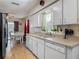 Bright eat-in kitchen with white cabinetry, stainless appliances and durable countertops at 830 Christy Dr, Port Orange, FL 32129