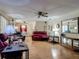 Inviting living room with hardwood floors, a ceiling fan, and plentiful natural light at 830 Christy Dr, Port Orange, FL 32129
