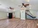 Open living room with durable floors, fan and natural light at 830 Christy Dr, Port Orange, FL 32129