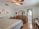 Comfortable main bedroom with furniture and ensuite bathroom at 830 Christy Dr, Port Orange, FL 32129