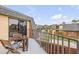The balcony features a small table and chair set with views of the neighborhood at 90 Cedar Dunes Dr, New Smyrna Beach, FL 32169
