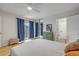 Bright bedroom with balcony access, mirrored closet, and an ensuite bathroom for added convenience at 90 Cedar Dunes Dr, New Smyrna Beach, FL 32169