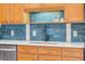 A close up on the kitchen sink, tile backsplash, quartz countertops, and stainless steel appliances at 90 Cedar Dunes Dr, New Smyrna Beach, FL 32169