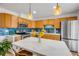 Renovated kitchen featuring stainless steel appliances, quartz countertop, tile backsplash, and ample cabinetry at 90 Cedar Dunes Dr, New Smyrna Beach, FL 32169