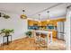 Eat-in kitchen featuring stainless steel appliances, tile backsplash, ample cabinetry, and Saltillo tile floor at 90 Cedar Dunes Dr, New Smyrna Beach, FL 32169