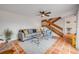 Comfortable living room featuring tile floors, a ceiling fan, a staircase, and a cozy seating area at 90 Cedar Dunes Dr, New Smyrna Beach, FL 32169