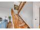 Inviting staircase with decorative tile risers and wooden railing, leading to the upper level of the home at 90 Cedar Dunes Dr, New Smyrna Beach, FL 32169