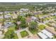 Charming neighborhood aerial featuring tree-lined streets and green lawns at 90 Cunningham Dr, New Smyrna Beach, FL 32168