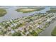 Scenic aerial view highlighting a home situated near waterfront properties and ocean access at 90 Cunningham Dr, New Smyrna Beach, FL 32168