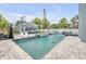 Spacious backyard with a long pool and an outdoor basketball court at 90 Cunningham Dr, New Smyrna Beach, FL 32168