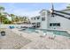 Relaxing backyard oasis with a sparkling pool and spacious seating area at 90 Cunningham Dr, New Smyrna Beach, FL 32168