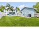 Spacious backyard with pool, home and additional structure in view at 90 Cunningham Dr, New Smyrna Beach, FL 32168