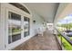 Spacious balcony with outdoor seating and neighborhood views at 90 Cunningham Dr, New Smyrna Beach, FL 32168