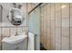 Well-designed bathroom with a modern sink and vanity, featuring a glass enclosed shower and tile accents at 90 Cunningham Dr, New Smyrna Beach, FL 32168