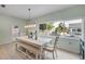 Bright dining room features a large window overlooking the pool and backyard at 90 Cunningham Dr, New Smyrna Beach, FL 32168