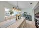 Open concept dining area leading to pool and backyard views at 90 Cunningham Dr, New Smyrna Beach, FL 32168