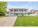 Charming two-story home with dual balconies, well-maintained landscaping, and a garage at 90 Cunningham Dr, New Smyrna Beach, FL 32168