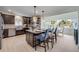 Stylish kitchen with dark wood cabinets, stainless steel appliances, granite counters, and a cozy breakfast nook at 90 Cunningham Dr, New Smyrna Beach, FL 32168