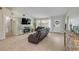 Cozy living room featuring a fireplace, TV, and comfortable seating at 90 Cunningham Dr, New Smyrna Beach, FL 32168
