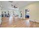 Open living space featuring wood-look floors, neutral paint, recessed lighting, and an inviting seating area at 90 Cunningham Dr, New Smyrna Beach, FL 32168