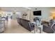 Open-concept living room with views into kitchen and entryway at 90 Cunningham Dr, New Smyrna Beach, FL 32168