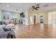 Spacious living room features wood floors, recessed lighting, neutral tones, and comfortable seating arrangement at 90 Cunningham Dr, New Smyrna Beach, FL 32168