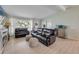 Inviting living room with leather sofas, natural light, and modern decor at 90 Cunningham Dr, New Smyrna Beach, FL 32168