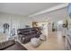 Spacious living room showcasing open layout and access to the kitchen and entryway at 90 Cunningham Dr, New Smyrna Beach, FL 32168