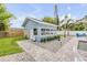 Pool house with a charming design and serene backyard setting at 90 Cunningham Dr, New Smyrna Beach, FL 32168