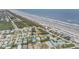 Panoramic aerial showing the house and surroundings close to the beach and neighborhood at 951 N Atlantic Ave, New Smyrna Beach, FL 32169