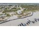 Aerial view of a coastal home with balconies, nestled on the beach with beautiful ocean views at 951 N Atlantic Ave, New Smyrna Beach, FL 32169