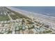 Panoramic aerial showing the house and surroundings close to the beach and neighborhood at 951 N Atlantic Ave, New Smyrna Beach, FL 32169