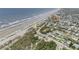 A captivating aerial view of a beach community near the ocean and waterway at 951 N Atlantic Ave, New Smyrna Beach, FL 32169