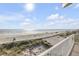 Wonderful beach views from this curved balcony with metal railings at 951 N Atlantic Ave, New Smyrna Beach, FL 32169