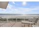Oceanfront balcony with lounge chair overlooking the beach and glistening ocean at 951 N Atlantic Ave, New Smyrna Beach, FL 32169